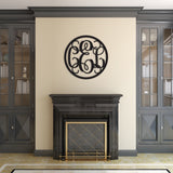 three letter circle monogram sign above mantle
