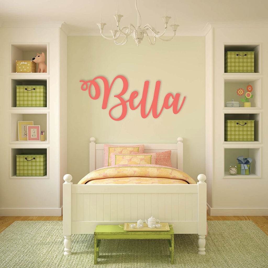 pink wooden monogram sign on bedroom wall