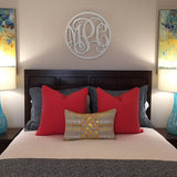 three letter circle monogram sign on bedroom wall